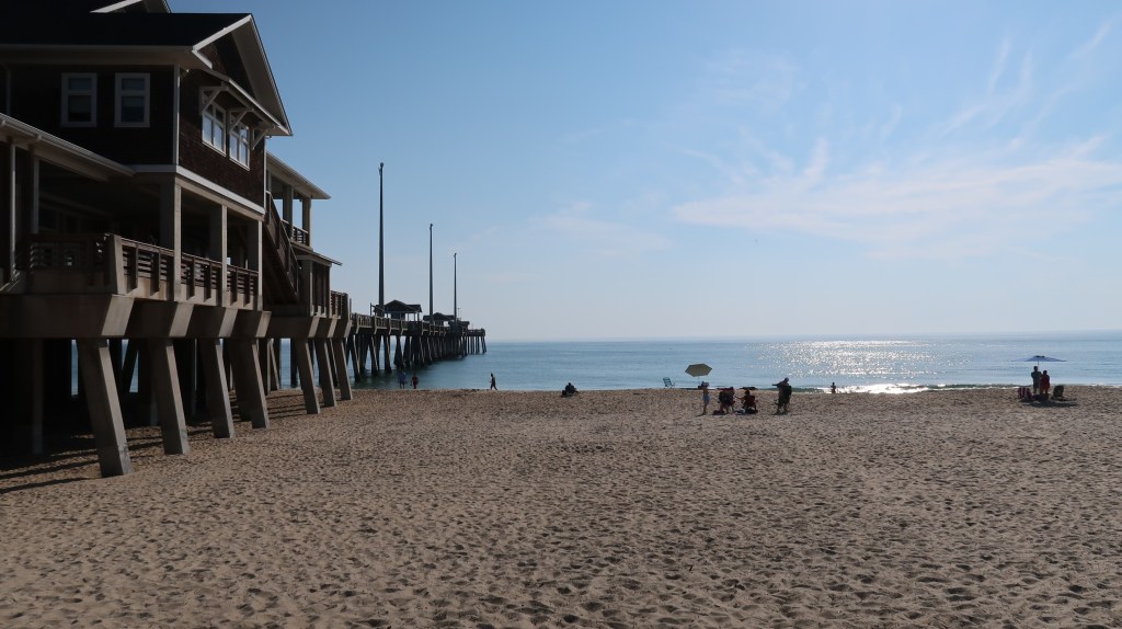 An expansive view of the sunny shore next to Jennette's Pier at Nags Head, North Carolina. Credit Sophia Friesen.